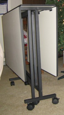 By day: an unassuming horizontal surface to collect clutter and dust